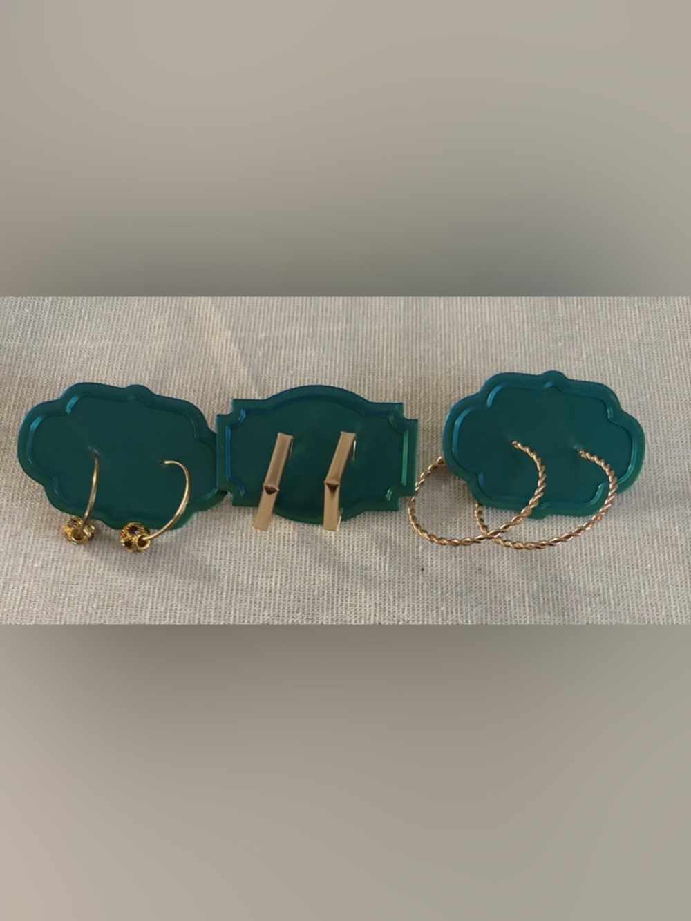 Three pair gold tone earrings